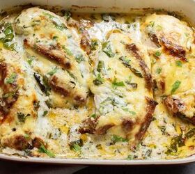 baked tuscan chicken casserole, Baked chicken breasts in a red dish topped with melted cheese and herbs