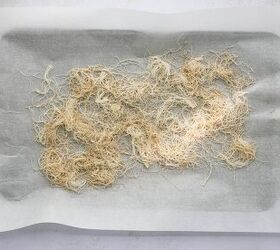 dubai chocolate pistachio protein energy balls, kataifi pastry mixed with coconut oil and cinnamon on a parchment lined baking sheet