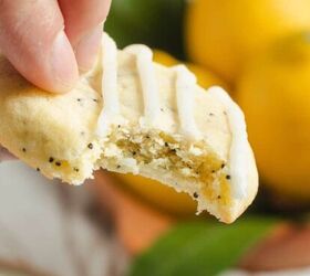 nicoise tuna salad recipe with a dijon dressing, Someone holding a lemon poppy seed cookie after having taken a bite out of it