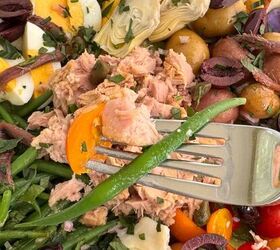 nicoise tuna salad recipe with a dijon dressing, Holding a fork of the salad