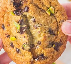 nicoise tuna salad recipe with a dijon dressing, Someone breaking open the chocolate chip pistachio cookie to show the gooey interior