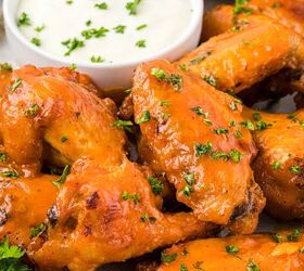 buffalo honey wings, These flavorful Buffalo Honey Wings are baked and then glazed with a honey buffalo sauce that takes these wings over the top The honey slightly mellows the hot sauce and adds amazing flavor you really can t eat just one These are delicious with your favorite blue cheese or ranch dip and are the perfect addicting appetizer for Game Day or your next gathering Here are the wings are on a serving plate with blue cheese dressing on the side