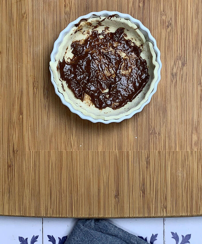apple rose tart for two, Pastry dough in bottom of tart dish and mixture of apricot preserve and cinnamon spread on bottom