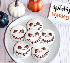 halloween jack skellington cookies with oreos, Halloween Jack Skellington cookies served on a white plate surrounded by mini pumpkins and a spooky season sign on a wooden background