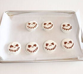 halloween jack skellington cookies with oreos, Halloween Jack Skellington cookies made from Oreos decorated with chocolate faces on a parchment lined tray