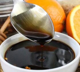 quick and easy teriyaki orange sauce recipe, Spoon drizzling rich teriyaki orange sauce into a white bowl with bright oranges and honey dipper as background props