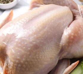 quick and easy teriyaki orange sauce recipe, Fresh whole turkey on a kitchen counter with carrots onions celery garlic lemon and assorted spices