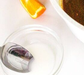 quick and easy teriyaki orange sauce recipe, Small glass bowl with cornstarch slurry next to orange wedges and simmering teriyaki orange sauce