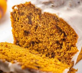 easy pumpkin bread with cake mix moist delicious, Tight close up shot of stacked pumpkin bread slices on a ceramic platter with visible glaze drip and chopped pecans