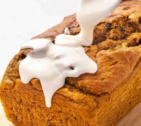 easy pumpkin bread with cake mix moist delicious, Close up of vanilla glaze being drizzled over a warm pumpkin bread loaf on a ceramic platter