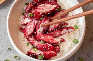 Sticky, sweet, salty, and a little bit charred, this chicken is irresistible