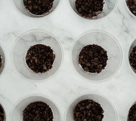 graveyard dirt cake cups easy no bake halloween, Clear plastic cups filled with a bottom layer of crushed Oreo cookie crumbs for Halloween dirt cake cups