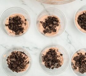 graveyard dirt cake cups easy no bake halloween, Dirt pudding cups layered with chocolate filling and topped with crushed Oreo cookie crumbs ready for Halloween dessert assembly