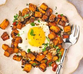 skillet sweet potato breakfast hash easy one pan recipe, Overhead shot of colorful sweet potato hash with runny eggs and chopped bell peppers on a round plate