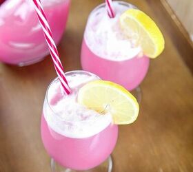 raspberry sherbet punch, punch topped with raspberry sherbet in a glass with a red and white straw