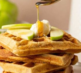 Freshly made apple cinnamon waffles with maple syrup drizzle