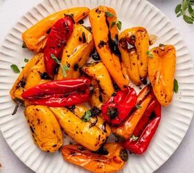 Easy roasted sweet peppers on a platter garnished with parsley in a white plate