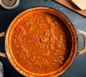 beef bolognese, Pot of hearty beef bolognese with spices surrounding it