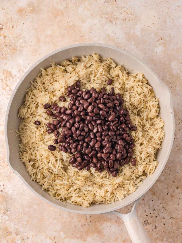 black beans and rice, Drained black beans sitting on top of the cooked rice just before being stirred together
