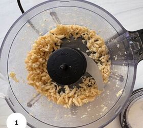 fresh mint pesto vegan gluten free, A food processor bowl containing roughly chopped garlic ready to be blended for mint pesto sits on a white countertop The blade is visible in the center surrounded by garlic pieces and labeled with a white circle showing the number 1