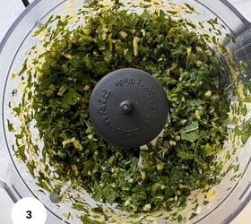 fresh mint pesto vegan gluten free, Chopped green herbs and garlic combine for a fresh mint pesto in a food processor bowl viewed from above A black blade attachment is visible in the center A white circle with the number 3 appears in the lower left corner