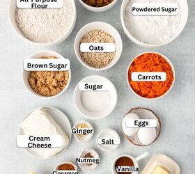 carrot cake cookies, Top down view of various baking ingredients in separate bowls golden raisins powdered sugar all purpose flour oats brown sugar granulated sugar shredded carrots cream cheese ginger nutmeg salt vanilla eggs baking soda and butter