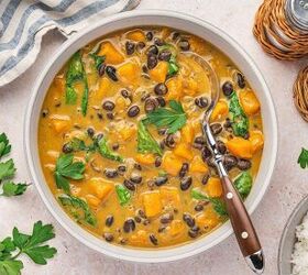 sweet potato black bean coconut curry easy one pot recipe, Hearty vegan coconut curry with sweet potatoes and spinach in a rustic bowl