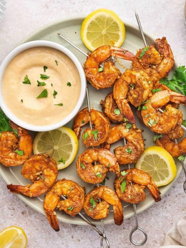 sweet potato black bean coconut curry easy one pot recipe, Oven baked shrimp skewers with spicy garlic aioli and lemon slices on a plate