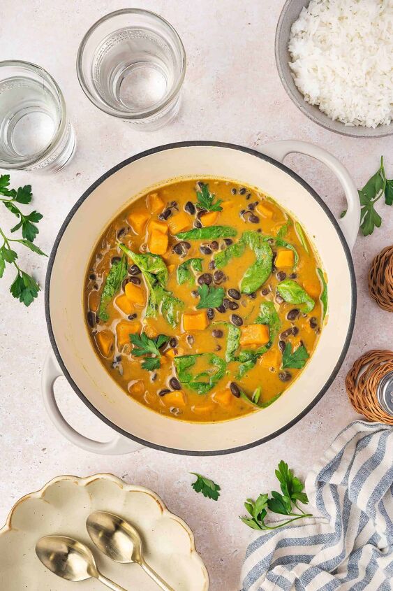 sweet potato black bean coconut curry easy one pot recipe, Vibrant coconut curry with sweet potatoes black beans and spinach in a pot