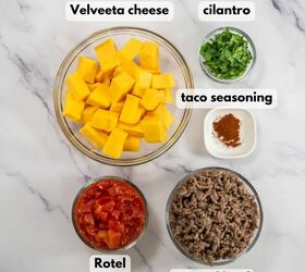 easy beef queso dip with rotel, Cubes of Velveeta cheese Rotel tomatoes taco seasoning and ground beef