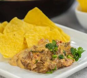 easy beef queso dip with rotel, Beef queso dip on a plate with tortilla chips