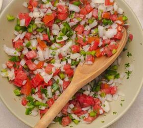 easy beef queso dip with rotel, A bowl of spicy pico de gallo with a wooden spoon