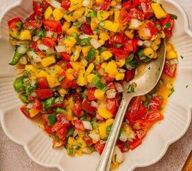 easy beef queso dip with rotel, Mango pico de gallo in a bowl with a spoon