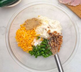 air fryer bacon wrapped jalapeno poppers, Cream cheese bacon bits green onions and other ingredients are in a mixing bowl