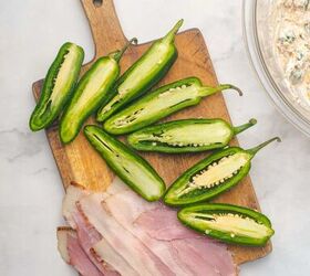 air fryer bacon wrapped jalapeno poppers, Sliced jalapeno peppers and bacon are on a cutting board