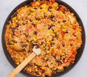 one pot cheesy mexican chicken and rice, Black beans and corn added to cheesy Mexican rice and chicken