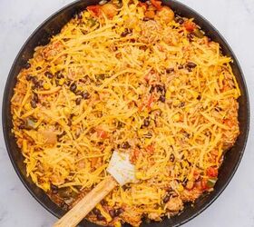 one pot cheesy mexican chicken and rice, Shredded cheddar cheese topped on Mexican chicken and rice