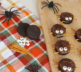 oreo spider cookies recipe for halloween parties, Halloween spider cookies made from Oreos with pretzel legs and candy eyes on a wooden serving board