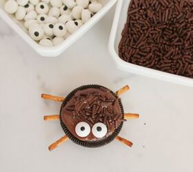 oreo spider cookies recipe for halloween parties, Finished Oreo spider cookie with candy eyes and chocolate sprinkles next to bowls of eyes and sprinkles