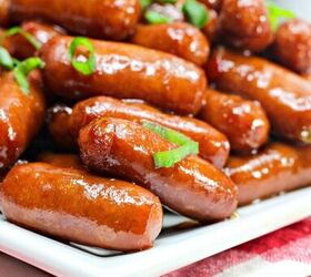 crockpot little smokies, a closeup of little smokies on a white plate with a red and white checkered napkin