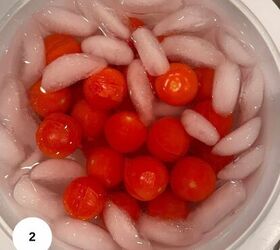 cherry tomato confit with basil and thyme mediterranean style, A bowl filled with cherry tomatoes submerged in ice water surrounded by ice cubes evokes a fresh Mediterranean vibe A white circle with the number 2 is in the bottom left corner