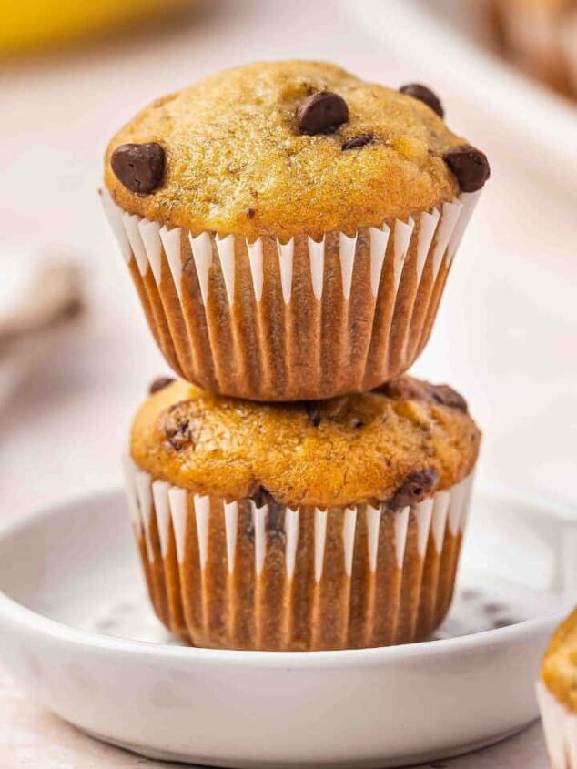 easy 3 ingredient pumpkin muffins with spice cake mix, Close up of a stack of golden banana mini muffins on a white platter