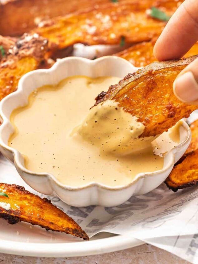 easy 3 ingredient pumpkin muffins with spice cake mix, Crispy sweet potato wedge being dipped into creamy homemade chipotle sauce showing a close up of the textures