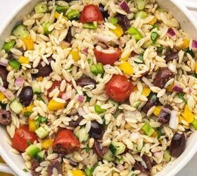 spooky cute air fryer mummy hot dogs kids will love, Close up of Mediterranean orzo pasta salad with cucumbers cherry tomatoes and olives