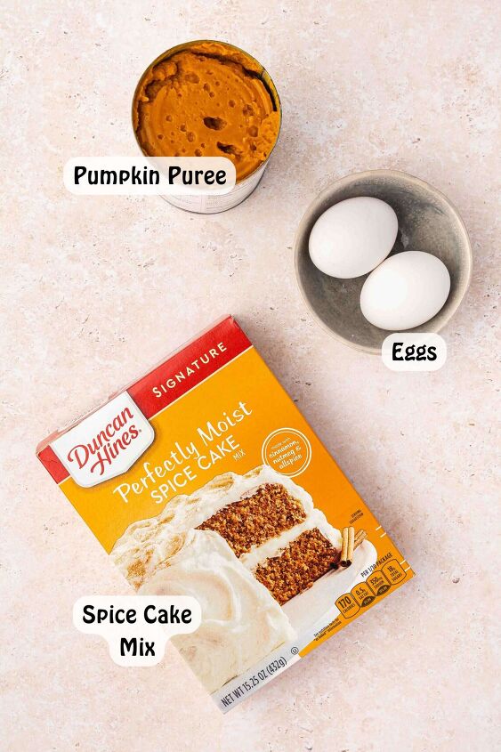 easy 3 ingredient pumpkin muffins with spice cake mix, Ingredients for 3 Ingredient Pumpkin Muffins spice cake mix canned pumpkin puree and eggs in a bowl