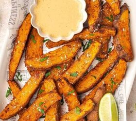 spooky cute air fryer mummy hot dogs kids will love, A vibrant plate of crispy air fryer sweet potato wedges garnished with fresh parsley served alongside a small bowl of creamy homemade chipotle sauce