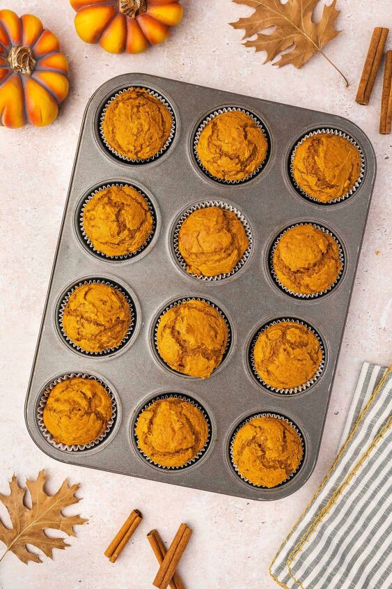 easy 3 ingredient pumpkin muffins with spice cake mix, Overhead view of freshly baked pumpkin muffins in a muffin tin