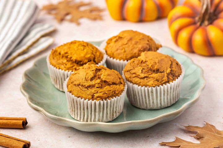 easy 3 ingredient pumpkin muffins with spice cake mix, Pumpkin muffins on a plate with small pumpkins and cinnamon sticks