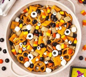 spooky halloween snack mix easy kid friendly recipe, Top down view of Halloween snack mix with candy corn mini marshmallows and candy eyes in a ceramic bowl