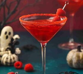 easy vampire kiss cocktail recipe for halloween 2025, Vampire Kiss Cocktail with sparkling wine glitter and fresh raspberries in a martini glass